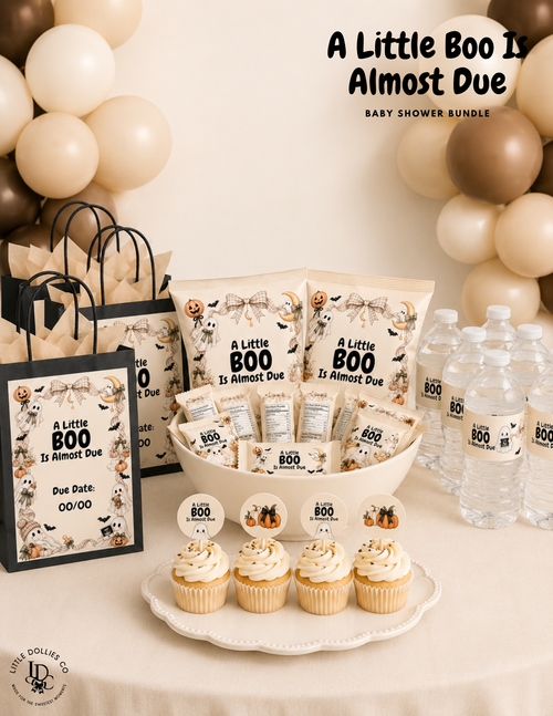 A Little Boo Is Almost Due Halloween baby shower setup featuring ghost decorations, baby shower favors, cupcakes, and neutral fall decor