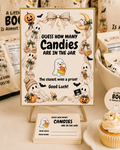 Halloween baby shower candy guessing game featuring A Little Boo Is Almost Due ghost and pumpkin decorations