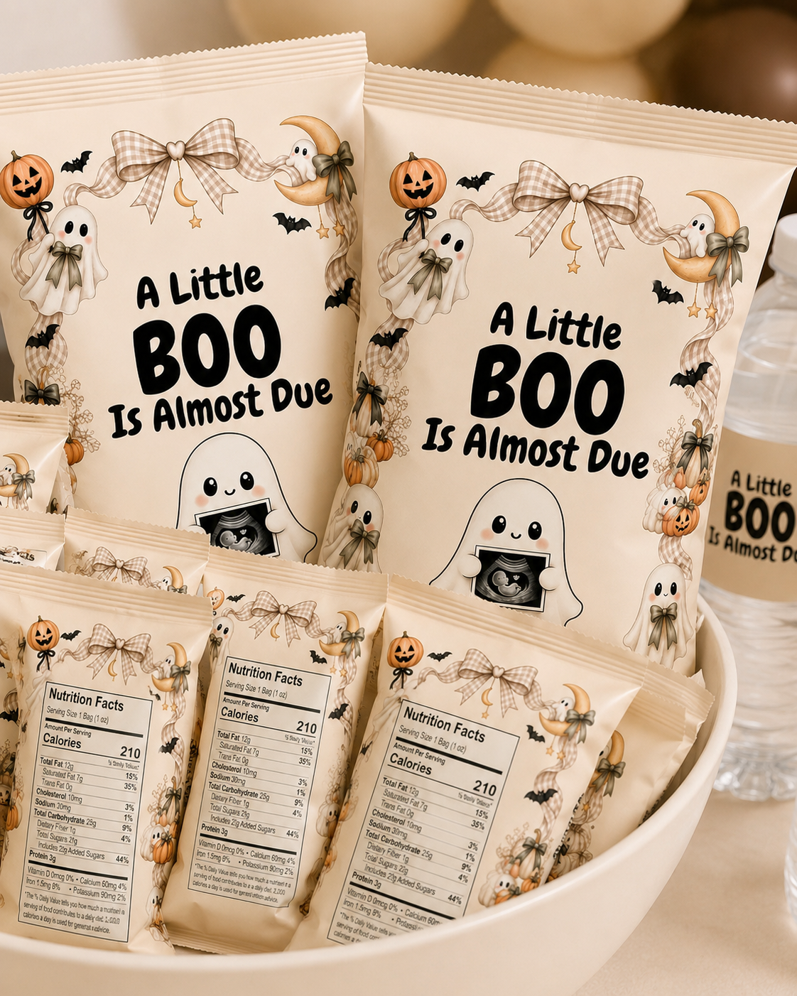 Spooky baby shower party favors featuring A Little Boo Is Almost Due designs on treat bags, candy packaging, and water bottles