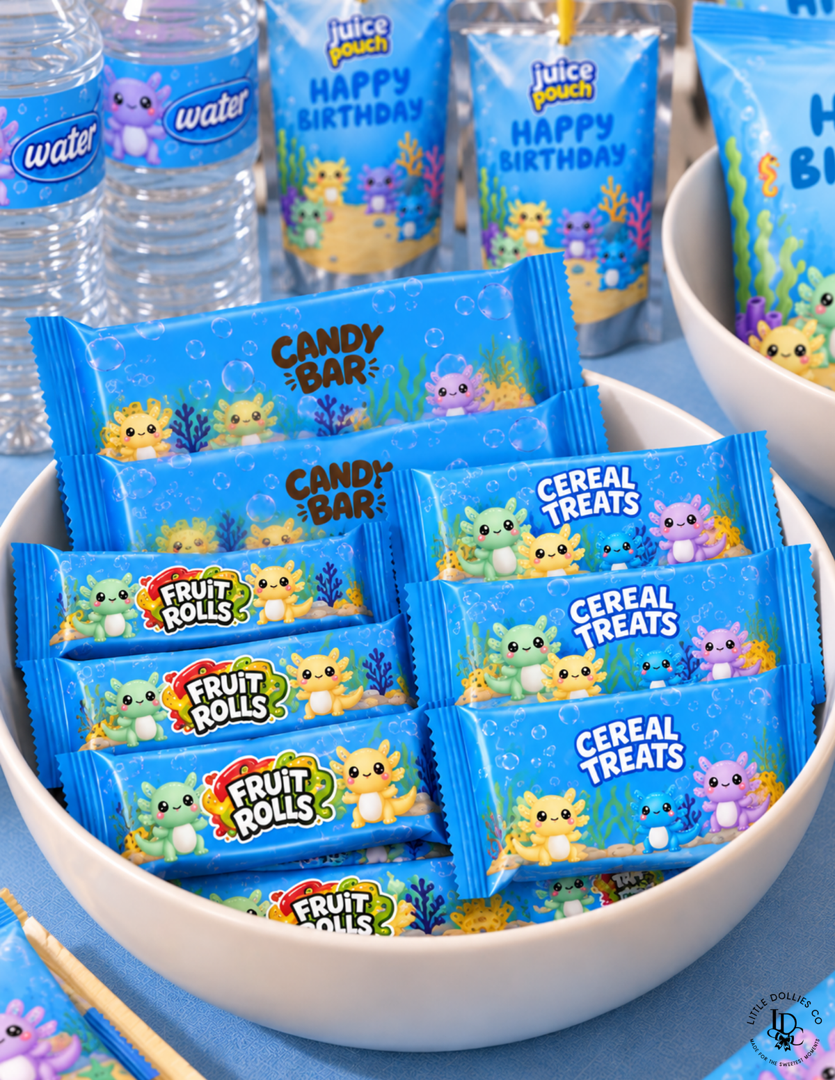 Axolotl birthday party treats featuring candy bar wrappers, fruit roll-up wrappers, and cereal treat wrappers with colorful axolotl designs