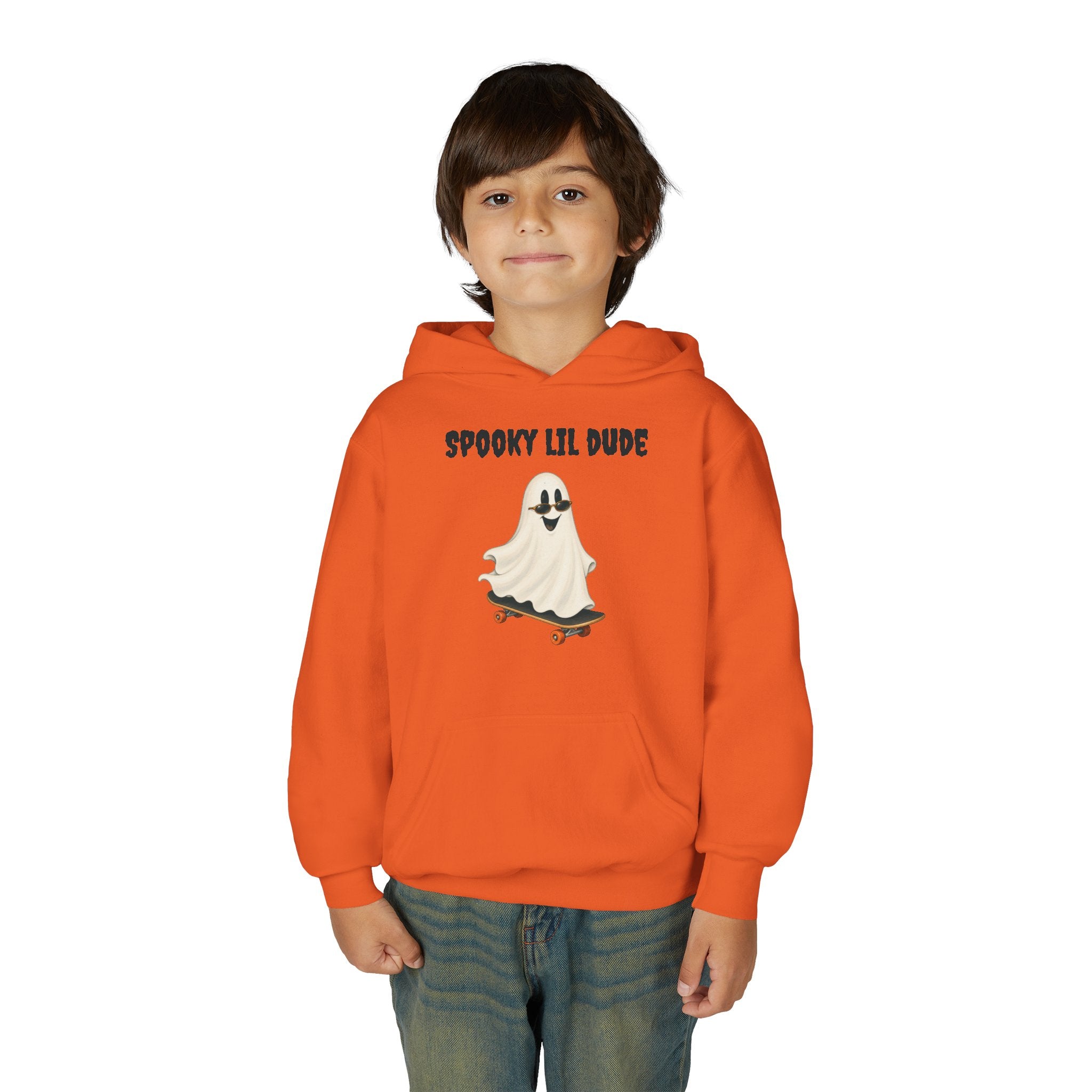 Child wearing an orange Spooky Lil Dude Halloween hoodie featuring a cute ghost riding a skateboard