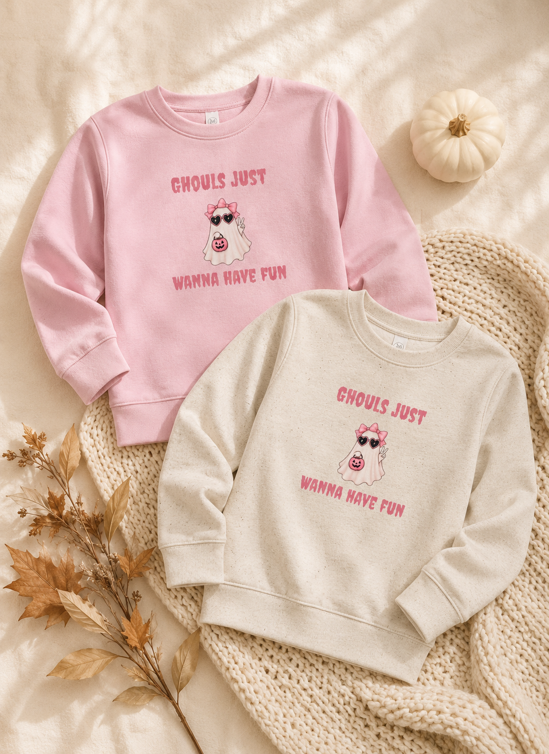 Cute Halloween sweater for toddler girls shown in pink and cream with an adorable ghost Halloween design.