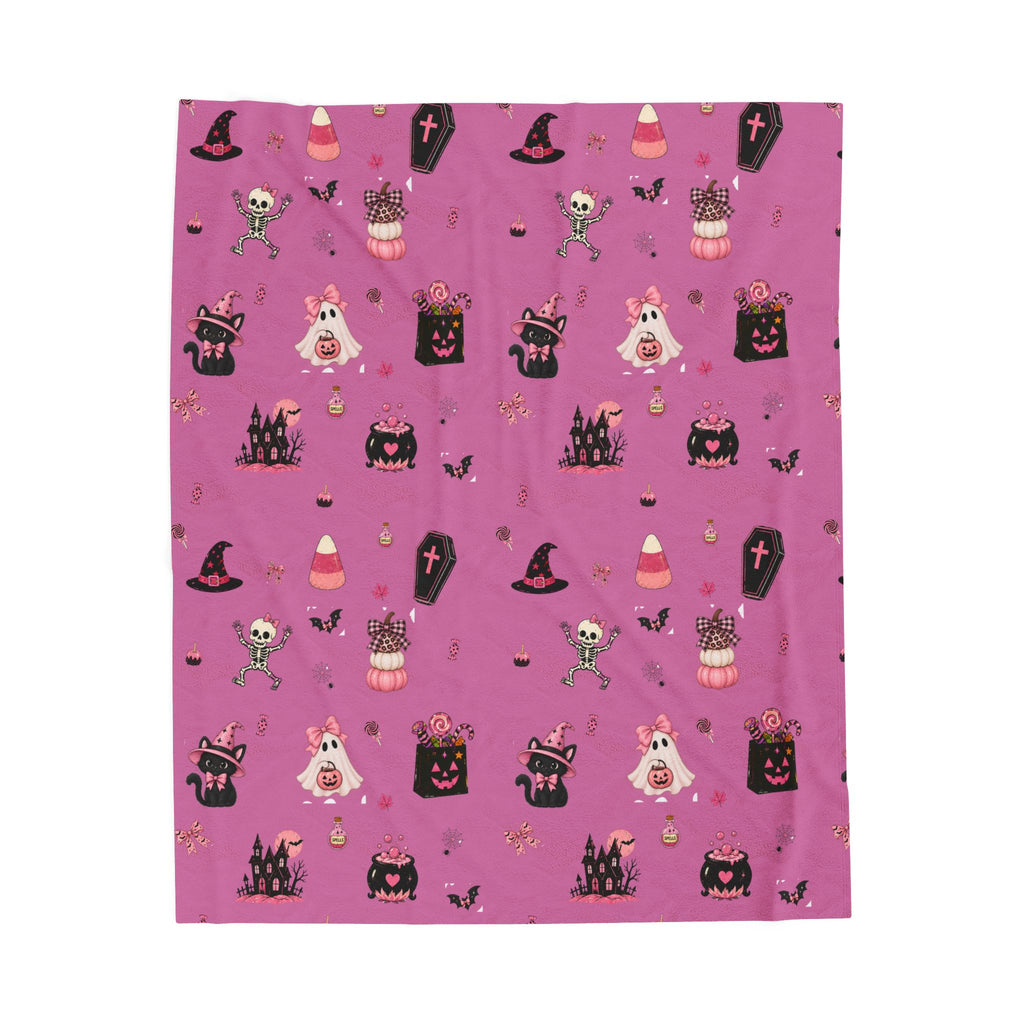 Cute girly Halloween blanket in pink with ghosts, witches, bats, pumpkins, candy and spooky Halloween designs