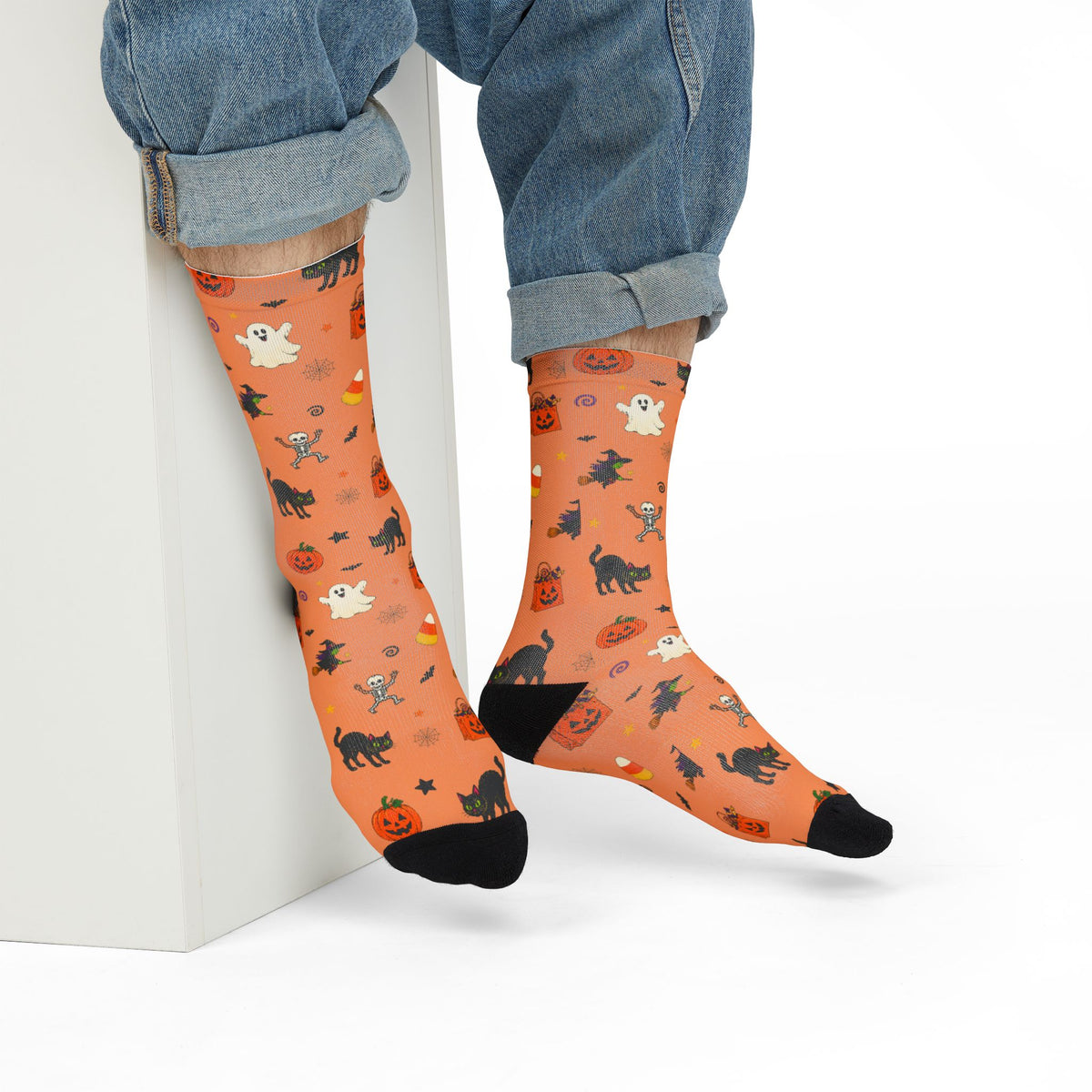 Festive Halloween socks featuring pumpkins, black cats, ghosts and candy corn
