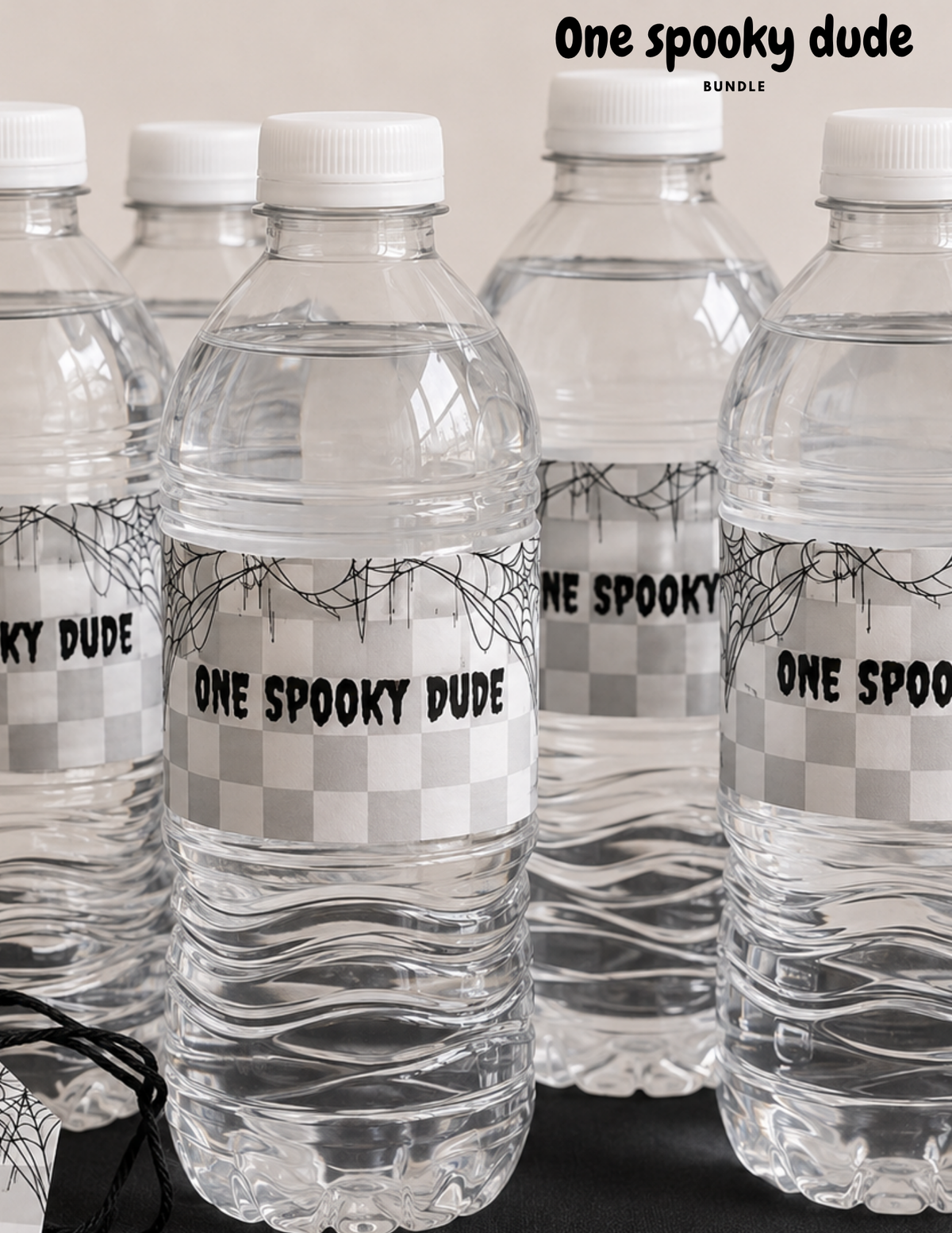 One spooky dude first birthday party after bottle labels. Featuring a checkered background with spider webs And “one spooky dude” lettering. Perfect for a Halloween first birthday