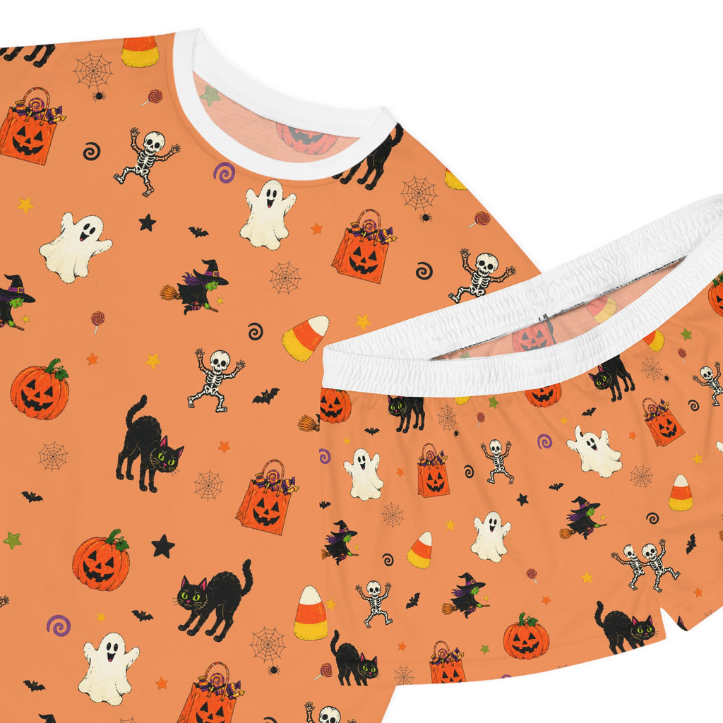 Orange Halloween pajama set for women with pumpkins, ghosts, bats and candy corn