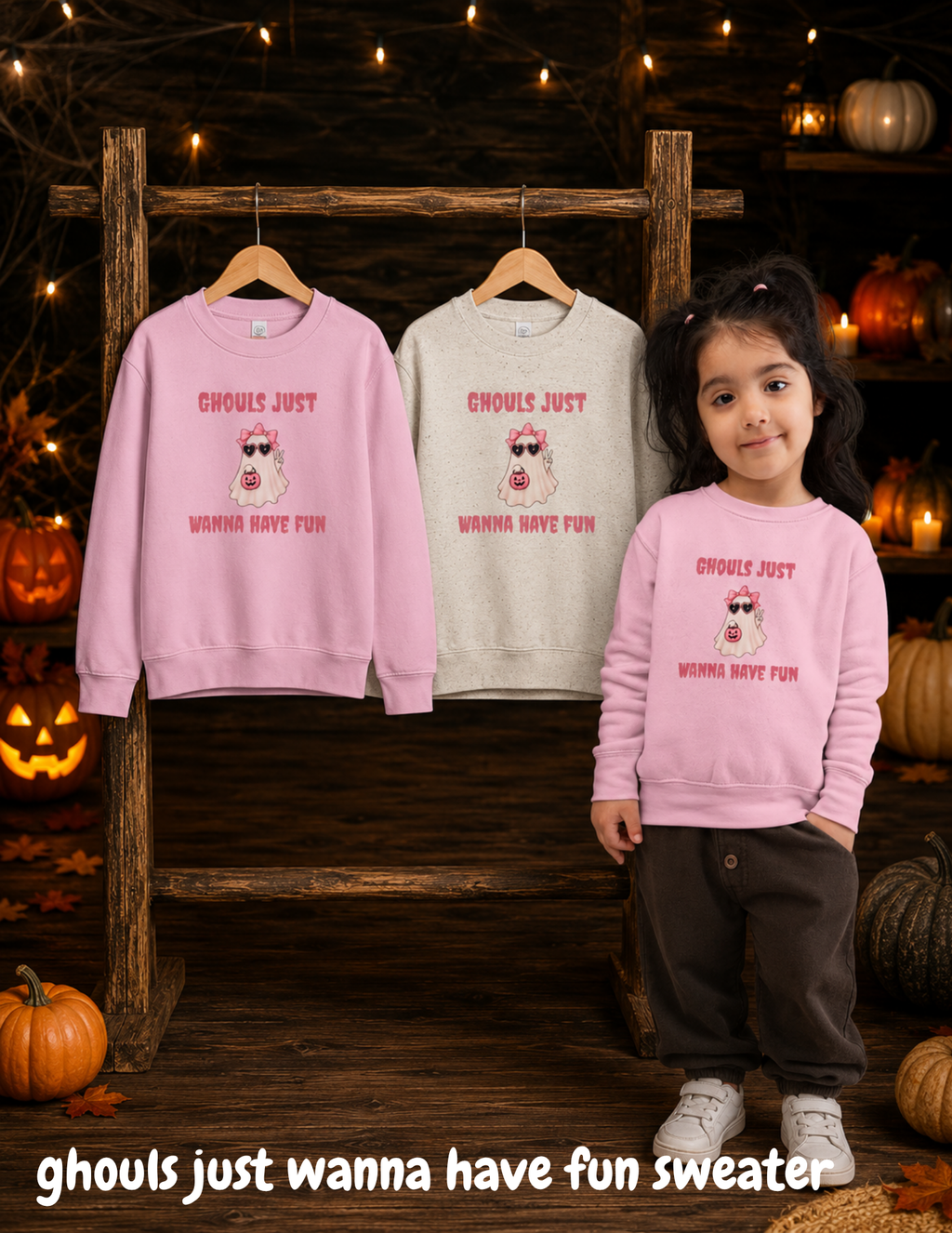 Toddler girl wearing a pink Halloween sweater featuring a cute ghost, bow, sunglasses and pumpkin with “Ghouls Just Wanna Have Fun” design.