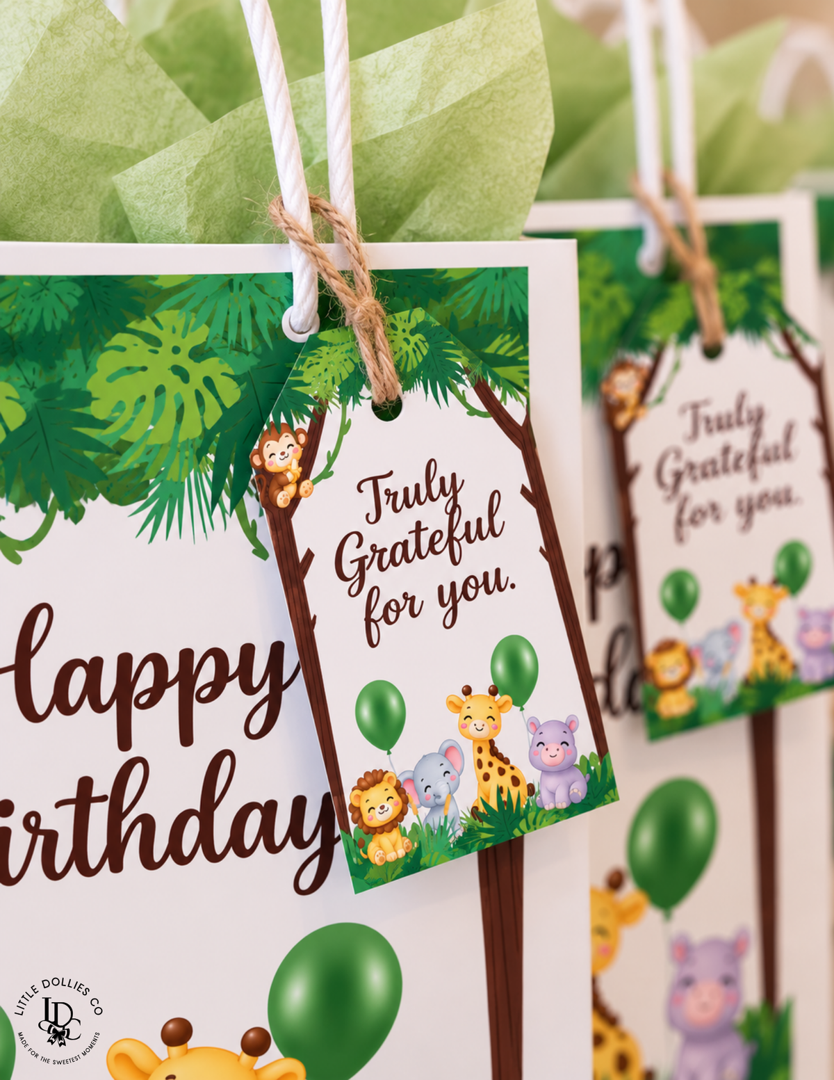 wild One first birthday favor thank you tags featuring giraffes, lions, elephants, balloons, and tropical jungle leaves